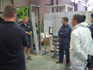 Team Meeting at Server Racks