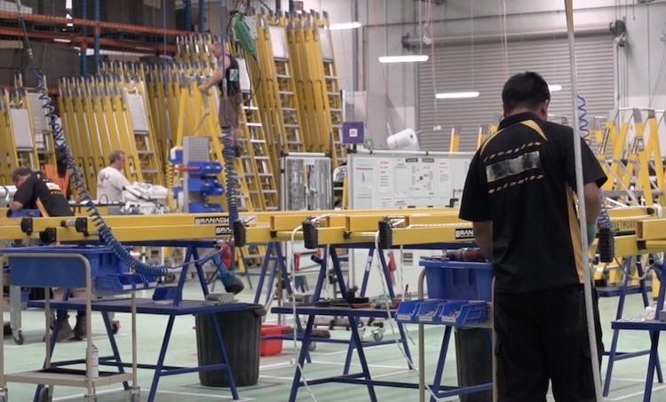 factory worker manufacturing a ladder