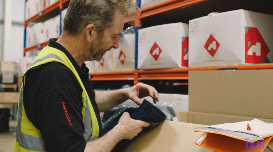 unpacking a box in a warehouse