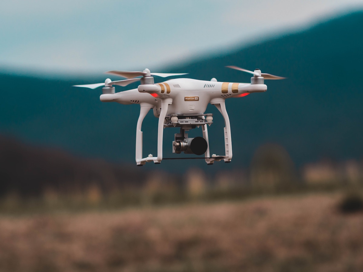 Drone flying above farming fields